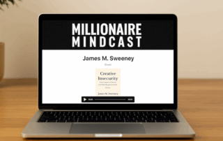 Laptop on a wooden desk displaying the Millionaire Mindcast podcast page featuring James M. Sweeney, symbolizing entrepreneurial success and thought leadership.